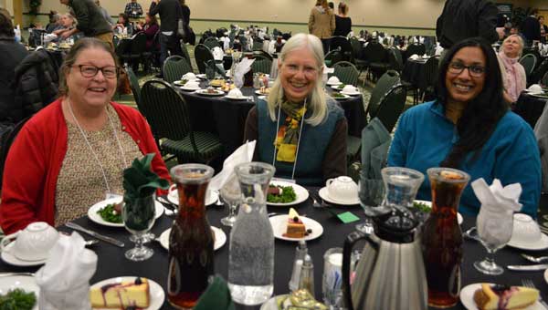three teachers sitting at a table at the Place Based Education Conference<br />
